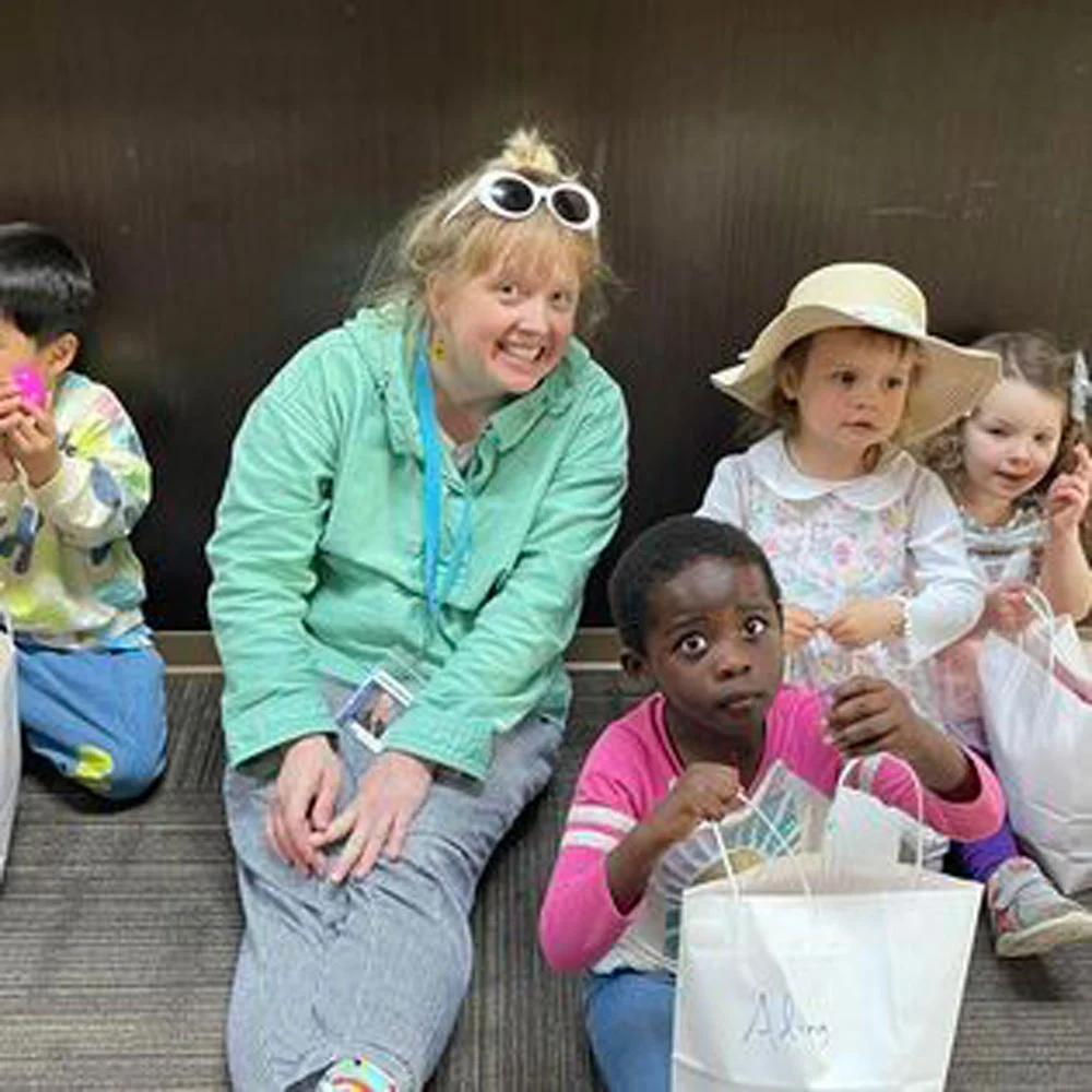 Kids And Teacher Sitting